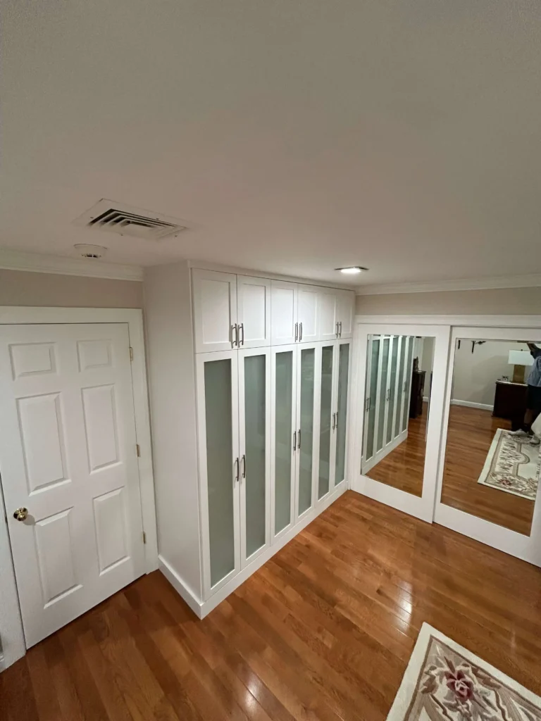 Custom built armoire with frosted glass doors